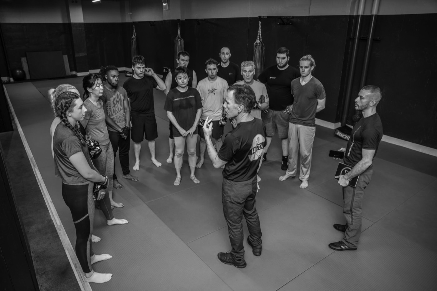 A KMI class of every age gathered around the instructor